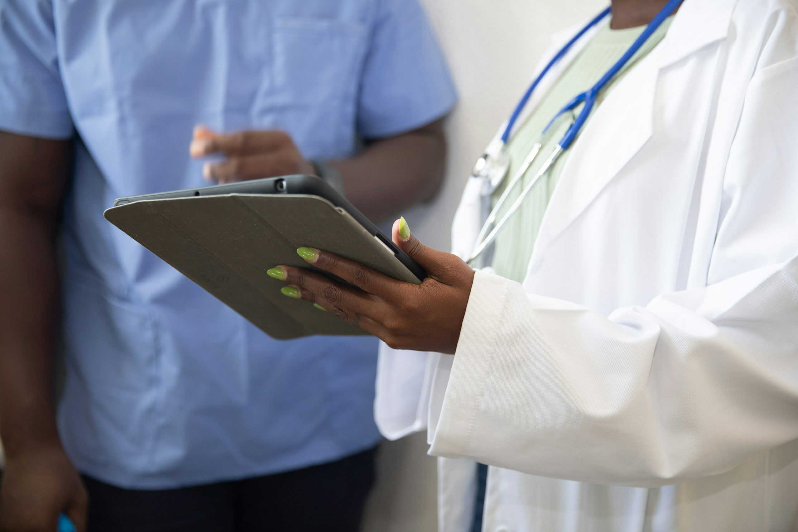 Healthcare professionals reviewing a clipboard