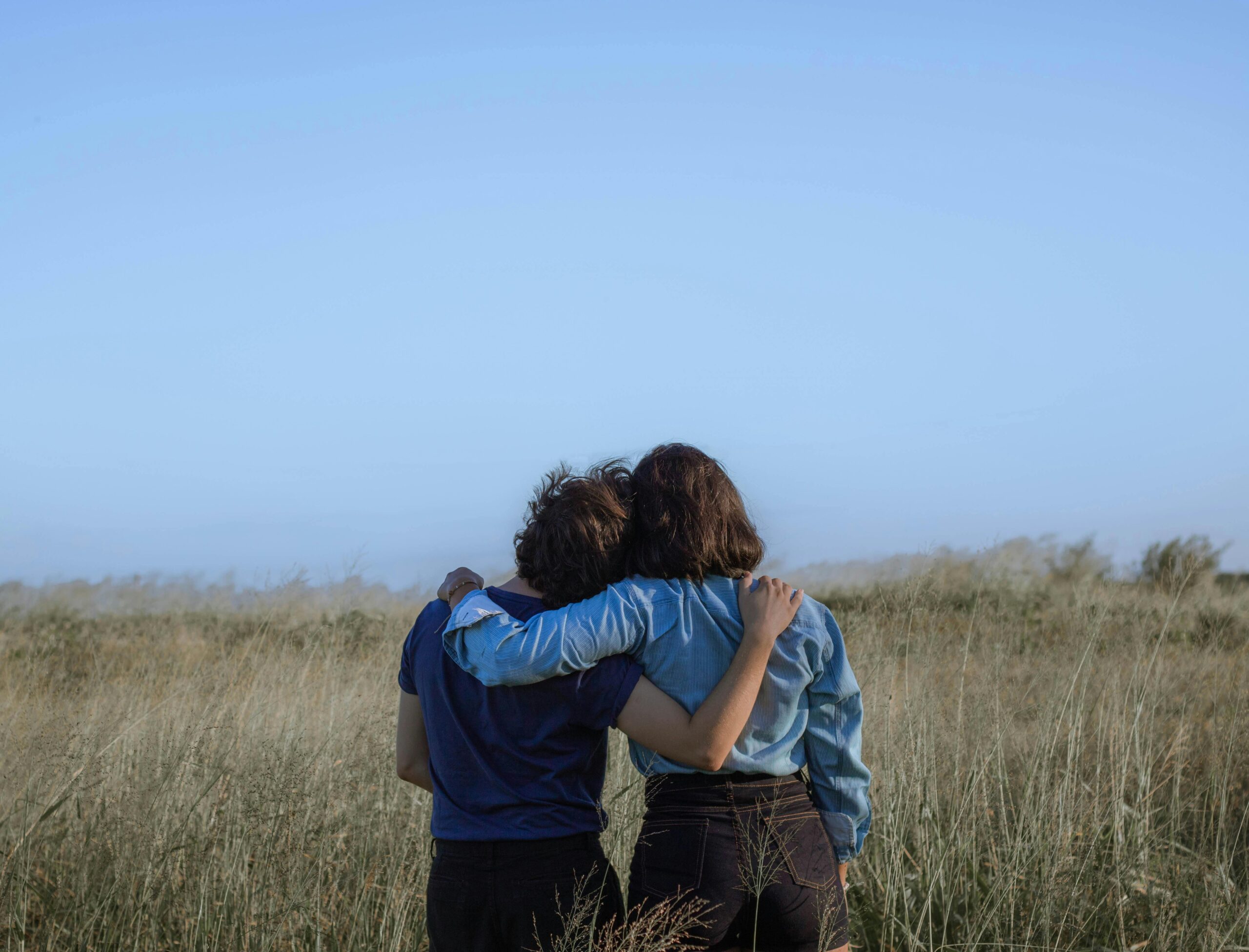 Two people embracing outdoors
